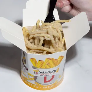 a hand holding a fork