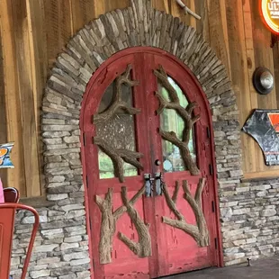 Back door into dining area. There&apos;s a covered porch with fans for outdoor dining.