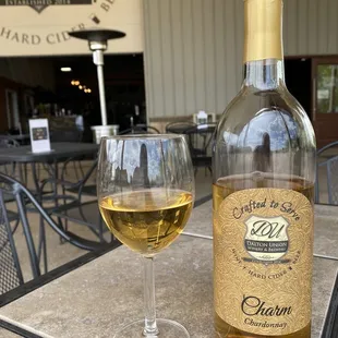 a glass of chardonne and a bottle of chardonne