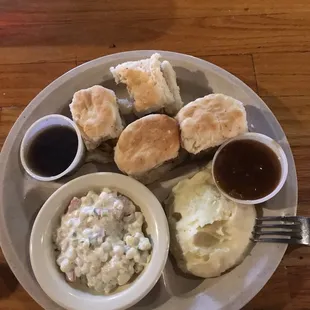 Chicken biscuits, corn salad, and mashed potatoes.