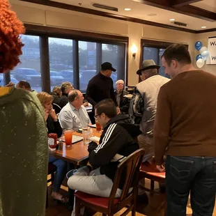 a group of people sitting at a table