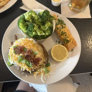 Lightly dusted lemon pepper Salmon fillet, baked potato and steamed broccoli