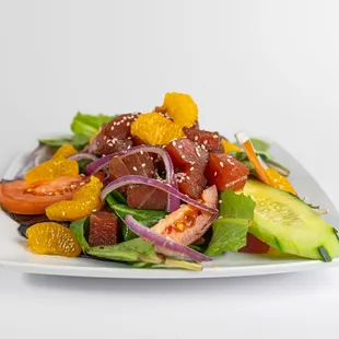 Savor the freshness of the sea with our Ahi Tuna Salad at Dalu Hawaiian BBQ! Enjoy tender slices of seared ahi tuna atop a bed of green mix