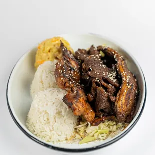 Aloha Mix plate! A mouthwatering combination of Calbi Ribs, Teriyaki Beef, and Teriyaki Chicken, served with macaroni salad and rice.