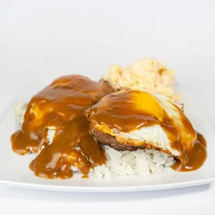 Loco Moco Plate at Dalu Hawaiian BBQ! Hamburger patty with a fried egg and smothered in savory gravy, served with macaroni salad and rice