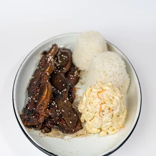 Calbi Ribs Plate at Dalu Hawaiian BBQ! Succulent ribs marinated in our signature Hawaii-inspired sauce, served with macaroni salad and rice