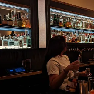a bar filled with bottles of liquor