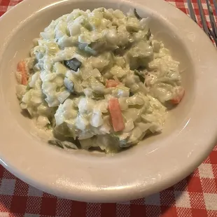 Cole slaw. Slightly sweet with a slightly oniony aftertaste