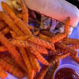 Shaved prime rib with onions, mushrooms and cheese - horseradish and au jus- sweet potatoe fried