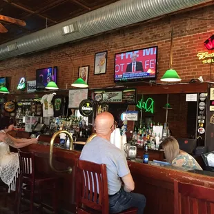 customers sitting at the bar