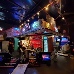 a bar with neon signs