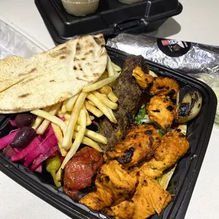 Chicken and Beef Kofta Mix Plate, comes with hummus and garlic sauce.