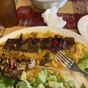 Flavorful Beef skewer, rice, and salad