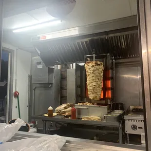 a large roaster with a lot of food in it