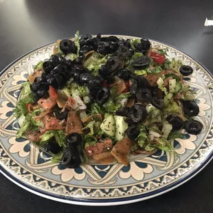 a plate of salad on a table