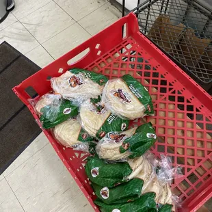 a red basket full of food