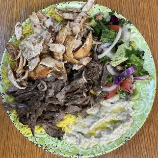 Mixed Shawarma Platter with hummus and salad sides.