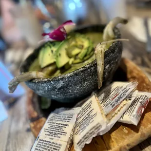 a bowl of avocado and chips