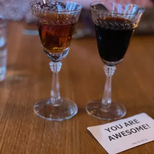 two glasses of wine and a note that says you are awesome