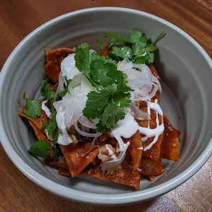 2/11/23 Chilaquiles - Salsa Roja, Crema, Machaca de Pescado, Poached Egg, Onion
