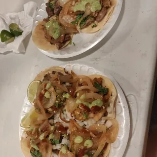 two plates of tacoss