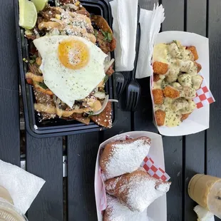 Birria Chilaquiles, loaded Cajun seasoned tots w/ hatch chile cheese &amp; beignets