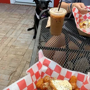 Breakfast tots with a fried egg and cold brew coffee