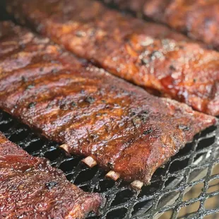 ribs cooking on a grill