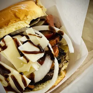 a sandwich with meat and cheese