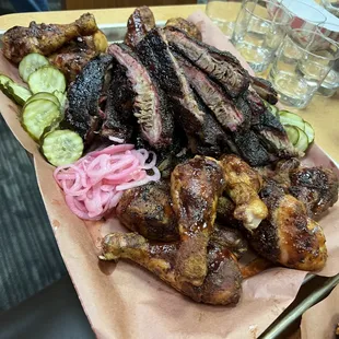 a platter of meat and vegetables