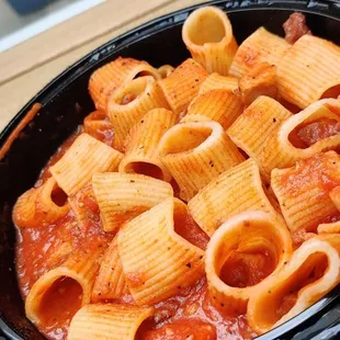 a close up of a bowl of pasta