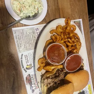 Damon's bbq platter with coleslaw and curly fries
