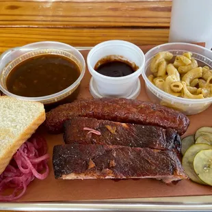 Ribs, sausage, mac &amp; cheese and pinto beans. Love the homemade pickles!