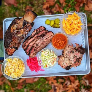 a tray of meat and sides