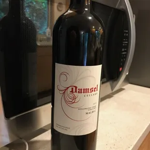 a bottle of wine on a counter