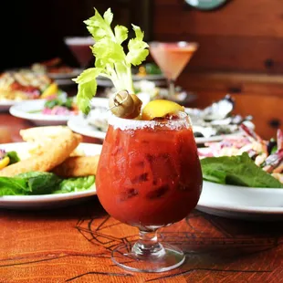 a bloody drink with a garnish garnish