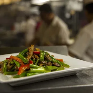 Ginger Shredded Duck - our duck is marinated and braised in-house before being shredded &amp; stir-fried with ginger, scallions &amp; bell peppers.