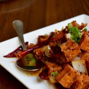 Cumin Fried Tofu - Fried tofu tossed in a cumin dry spice rub with onions &amp; bell peppers