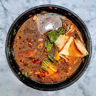 SICHUAN BEEF NOODLE SOUP | 川味牛肉湯麵替代手扯麵: sliced braised beef, hand ripped noodles and bok choy in a spicy beef broth - spice: 3/5. $17.95