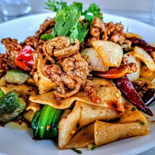 CUMIN LAMB HAND-RIPPED NOODLES | 乾拌孜然羊手扯麵: our signature cumin lamb dish served on top of hand ripped noodles - spice: 3/5. $14.75