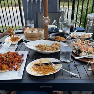 Dry pepper chicken, Szechuan rice, soup dumplings, dan dan noodles, and sizzling wonton platter
