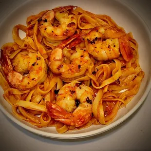 Takeout plated at home: Shrimp Diavalo + Fettuccine added Calabrian chili flakes+olive oil= DELISH!