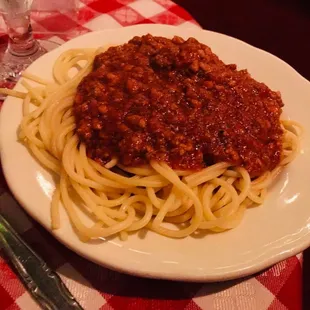 The side of spaghetti with meat sauce that comes with the steak