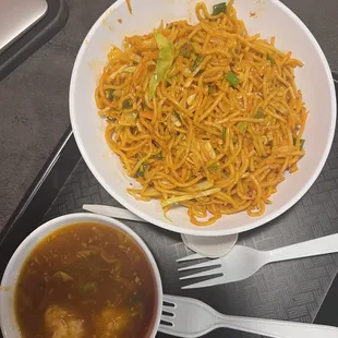 Info Chinese chow mein with some sort of spicy sauce on the side..
