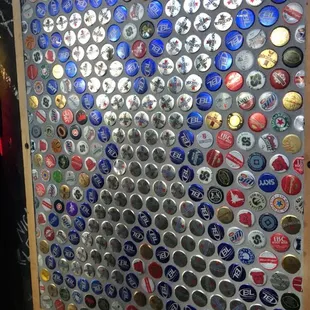 a display of beer bottle caps