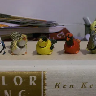 Mary Lou Higgins was selling these nervous birds for a buck apiece. In the breeze their little tails and heads shiver.