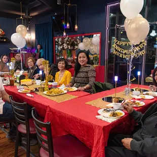 December 30, 2023 - Family enjoying dinner around the table.