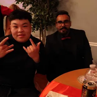 two men sitting at a table