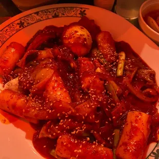 a plate of food with meat and vegetables