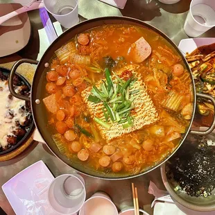 Budae jjigae, Fried chicken with cheese, Pork cartilage with rice bowl, Spicy sauteed squid.